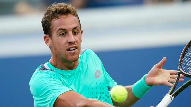 Roberto Carballes Baena, of Spain, returns a shot to Denis Shapovalov, of Canada, during the second round of the U.S. Open tennis championships, Thursday, Sept. 1, 2022, in New York. (Frank Franklin II/AP)