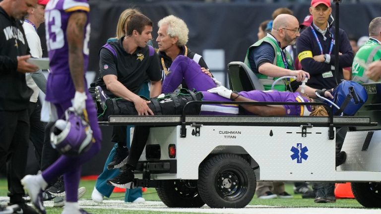 Minnesota Vikings safety Lewis Cine (6) is taken from the field after an injury during an NFL match between Minnesota Vikings and New Orleans Saints at the Tottenham Hotspur stadium in London, Sunday, Oct. 2, 2022. (Frank Augstein/AP)