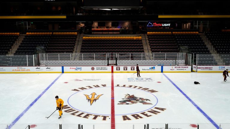 Members of the Arizona State University hockey team skate on the ice at the new Mullett Arena. (Ross D. Franklin/AP)