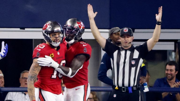 Tampa Bay Buccaneers wide receiver Mike Evans (13) and Julio Jones (6) celebate after Evans caught a touchdown pass in the second half of a NFL football game in Arlington, Texas, Sunday, Sept. 11, 2022. (Ron Jenkins/AP) 