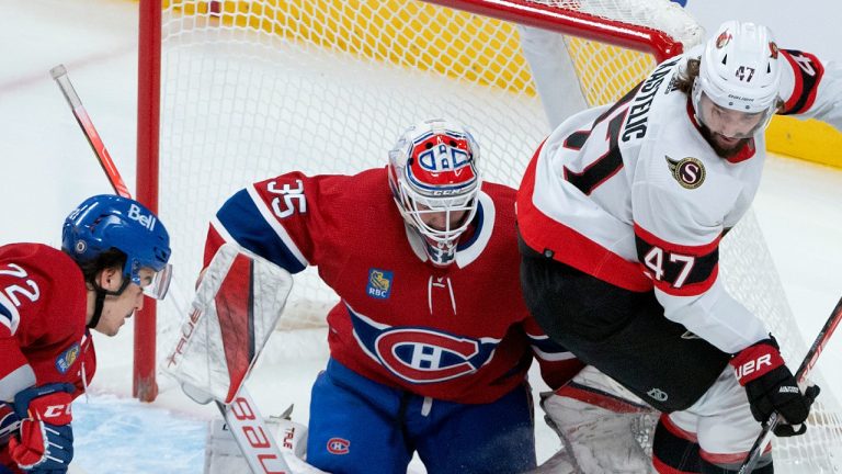 Montreal Canadiens goalie Sam Montembeault and teammate Arber Xhekaj (72) hustle to clear the puck away from Ottawa Senators' Mark Kastelic (47) during first period NHL hockey action in Montreal, Tuesday, Oct. 4, 2022. THE CANADIAN PRESS/Peter McCabe