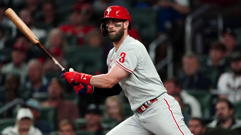 Philadelphia Phillies designated hitter Bryce Harper (3) hits a double during the second inning in Game 2 of baseball's National League Division Series between the Atlanta Braves and the Philadelphia Phillies, Wednesday, Oct. 12, 2022, in Atlanta. (John Bazemore/AP) 