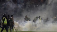 125 die as tear gas triggers crush at Indonesia soccer match