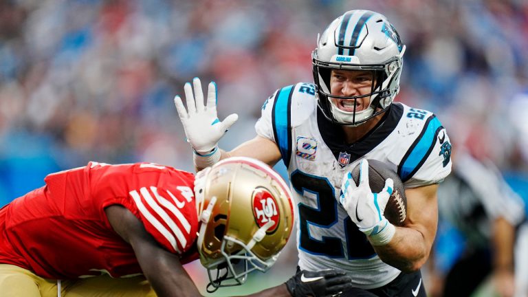 Carolina Panthers running back Christian McCaffrey runs past San Francisco 49ers cornerback Emmanuel Moseley during the second half an NFL football game on Sunday, Oct. 9, 2022, in Charlotte, N.C. (AP Photo/Rusty Jones) 