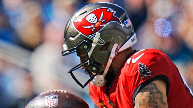 Tampa Bay Buccaneers wide receiver Mike Evans (13) drops a pass during the first half of an NFL football game against he Carolina Panthers Sunday, Oct. 23, 2022, in Charlotte, N.C. (AP Photo/Rusty Jones)