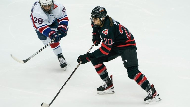 United States' Amanda Kessel (28) defends as Canada's Sarah Nurse brings the puck up ice during the first period of a women's exhibition hockey game billed as the "Rivalry Rematch", Saturday, March 12, 2022, in Pittsburgh. (Keith Srakocic/AP)