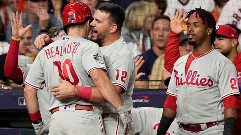 Philadelphia Phillies' J.T. Realmuto celebrates his home run during the 10th inning in Game 1 of baseball's World Series between the Houston Astros and the Philadelphia Phillies. (David J. Phillip/AP)