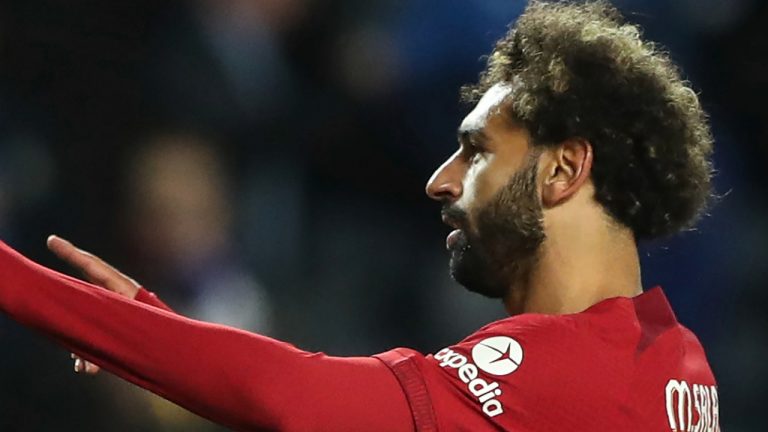 Liverpool's Mohamed Salah celebrates with teammates after scoring his side's fifth goal during the Champions League Group A soccer match between Rangers and Liverpool at Ibrox stadium in Glasgow, Scotland, Wednesday, Oct. 12, 2022. (AP Photo/Scott Heppell)