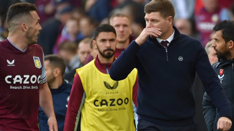 Aston Villa's head coach Steven Gerrard, second right, speaks to Aston Villa's John McGinn, second left, as they leave at the half-time of the English Premier League soccer match between Aston Villa and Chelsea at Villa Park in Birmingham, England, Sunday, Oct. 16, 2022. (AP Photo/Rui Vieira)