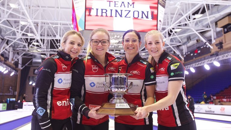 Silvana Tirinzoni, Alina Pätz, Carole Howald and Briar Hürlimann-Schwaller celebrate with the Boost National women's trophy on Oct. 9, 2022, at Memorial Gardens in North Bay, Ont. (Anil Mungal/GSOC)