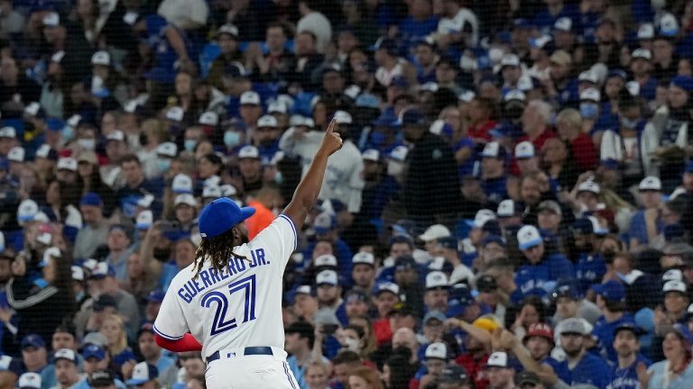 Toronto Blue Jays first baseman Vladimir Guerrero Jr. (27) acknowledges the crowd as he gets into position to start first inning MLB baseball action against the Texas Rangers, in Toronto, Friday, April 8, 2022.