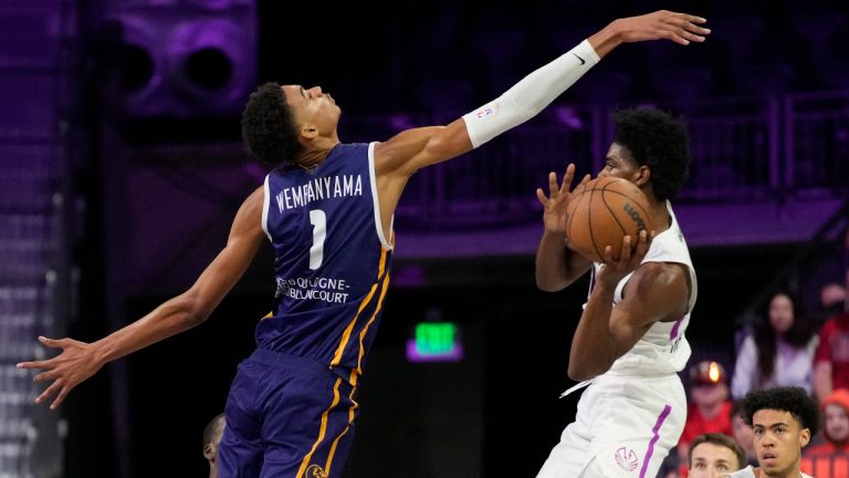 Boulogne-Levallois Metropolitans 92's Victor Wembanyama, left, guards NBA G League Ignite's Scoot Henderson during the second half of an exhibition basketball game Tuesday, Oct. 4, 2022, in Henderson, Nev. (John Locher/AP) 