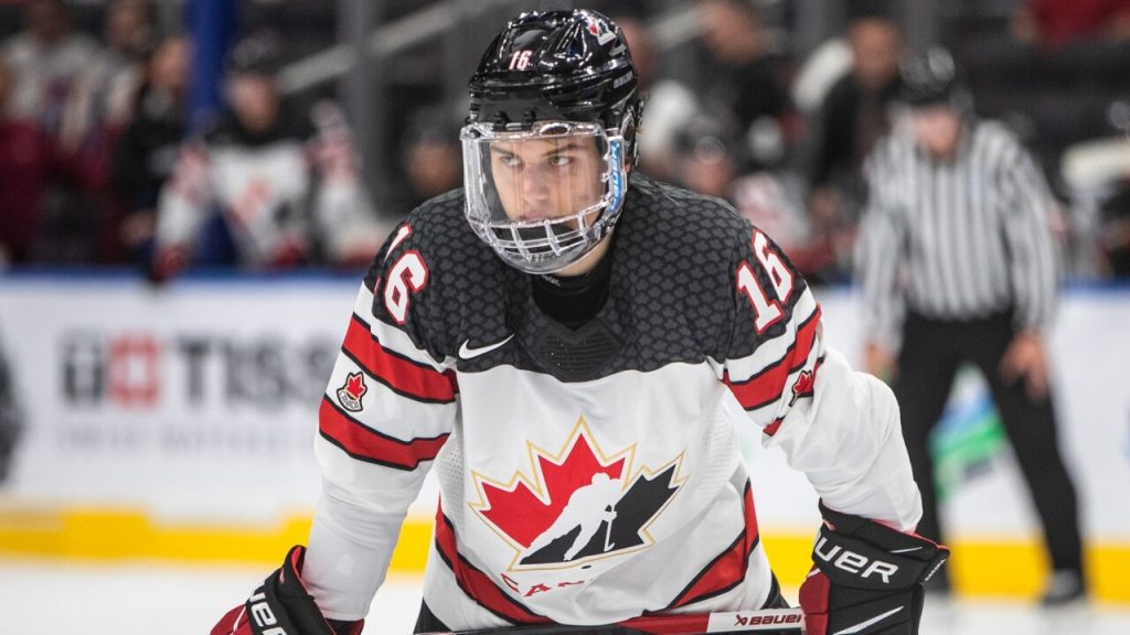 Hats are thrown from the crowd as Canada's Connor Bedard