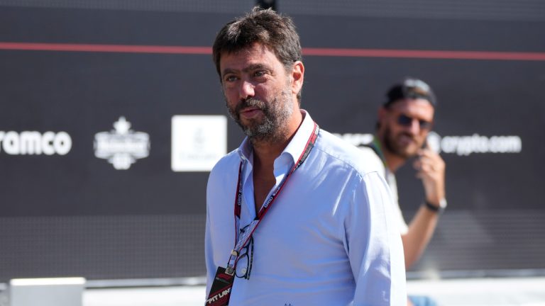 Juventus president Andrea Agnelli arrives prior to the start of the third free practice at the Monza racetrack, in Monza, Italy, Sept. 10, 2022. Juventus president Andrea Agnelli, vice president Pavel Nedved and CEO Maurizio Arrivabene are among 15 people who could face a trial for alleged false accounting and irregularities in player transfers following a notification from the public prosecutor's office in Turin. The prosecutor's office announced on Monday that 16 subjects were under investigation: Juventus and 15 people. A request for home arrest for Agnelli was rejected by a preliminary judge. (Luca Bruno/AP)