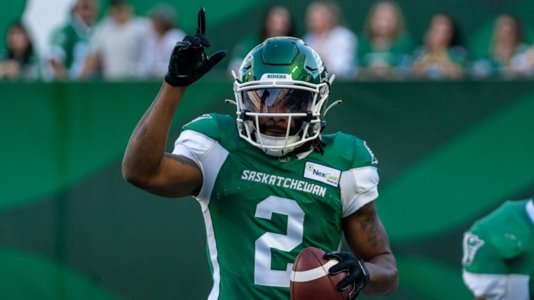 Saskatchewan Roughriders punt returner Mario Alford (2) celebrates after scoring a touchdown against Toronto Argonauts during second quarter of CFL football action against Toronto Argonauts in Regina, on Sunday, July 24, 2022. (Heywood Yu/CP)