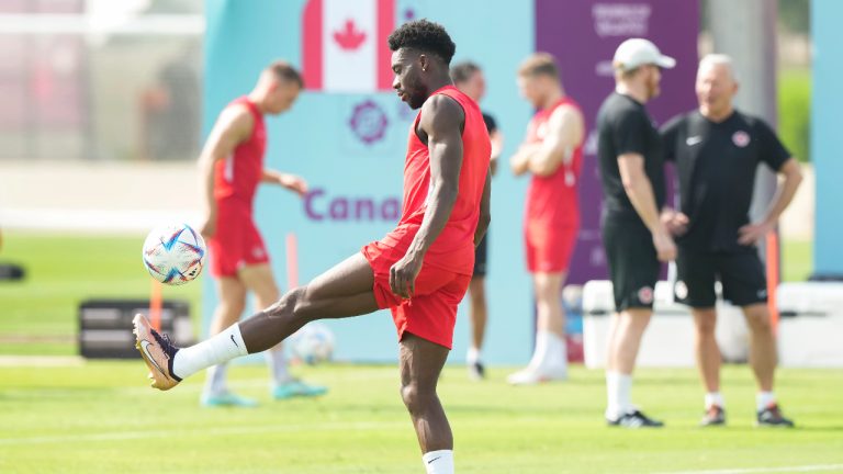 Canada defender Alphonso Davies kicks the ball during practice ahead of the World Cup in Doha, Qatar on Saturday. (Nathan Denette/CP)