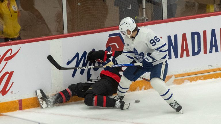 Toronto Maple Leafs right wing Nicolas Aube-Kubel (96) hits Ottawa Senators defenseman Jacob Bernard-Docker (24) against the boards during first period NHL pre-season action at the CAA arena in Belleville, Ont., on Friday, September 30, 2022. THE CANADIAN PRESS/Lars Hagberg