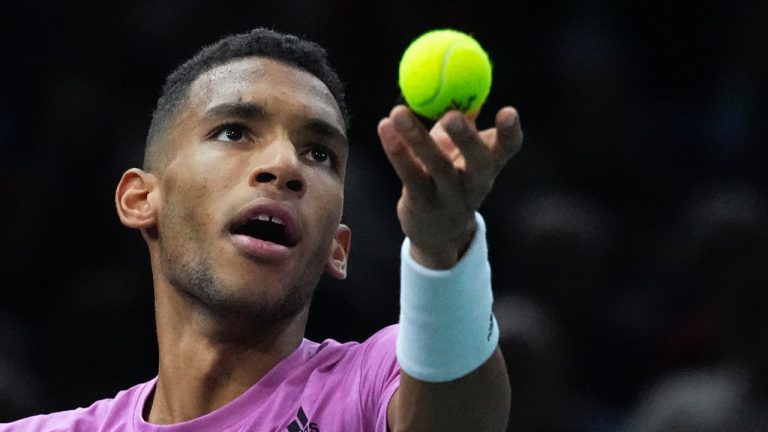 Felix Auger-Aliassime of Canada serves to Holger Rune from Denmark during their semi final match of the Paris Masters tennis tournament at the Accor Arena in Paris, Saturday, Nov. 5, 2022. (Michel Euler/AP)