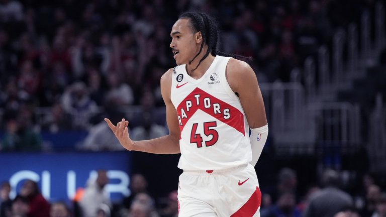 Toronto Raptors guard Dalano Banton (45) reacts after a three-point basket during the first half of an NBA basketball game against the Detroit Pistons, Monday, Nov. 14, 2022, in Detroit. (Carlos Osorio/AP)