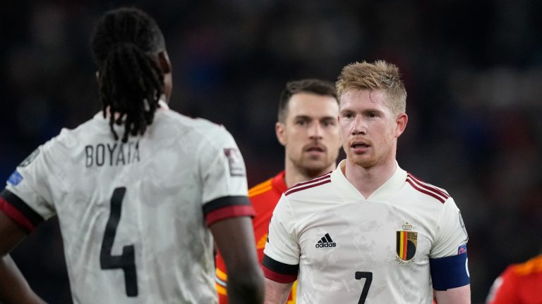 Belgium's Kevin De Bruyne, right, speak with Belgium's Dedryck Boyata at the end of the World Cup 2022 group E qualifying soccer match between Wales and Belgium at Cardiff City stadium in Cardiff, Wales, Tuesday, Nov. 16, 2021. (AP Photo/Frank Augstein)