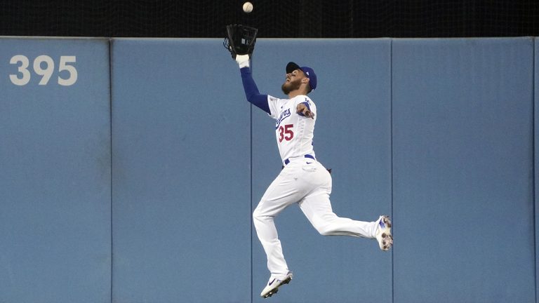 Los Angeles Dodgers centre fielder Cody Bellinger makes a leaping catch during Game 2 of the NL Division Series, Wednesday, Oct. 12, 2022, in Los Angeles. (Mark J. Terrill/AP)