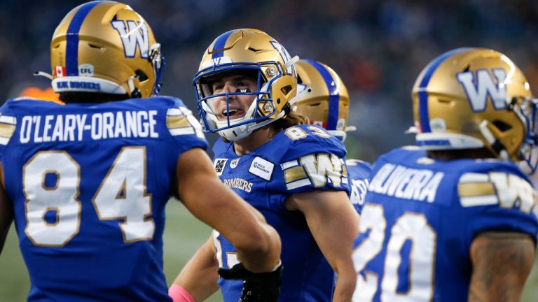 Winnipeg Blue Bombers' Dalton Schoen (83) and Brendan O’Leary-Orange (84) celebrate Schoen’s touchdown against the Edmonton Elks during first half CFL action in Winnipeg Saturday, October 8, 2022. (John Woods/CP)