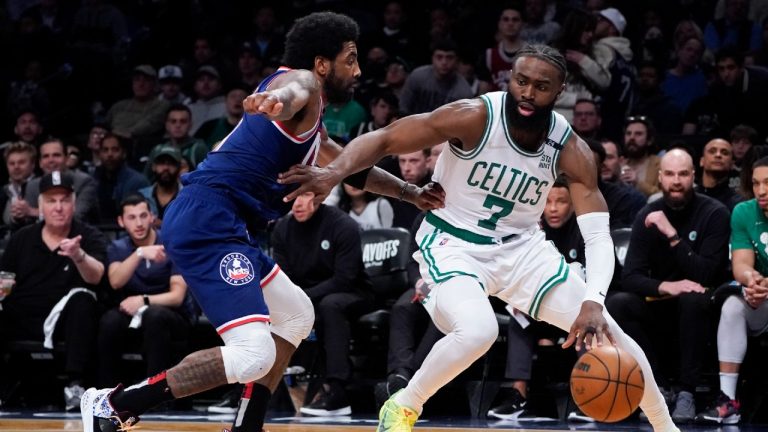 Boston Celtics guard Jaylen Brown (7) drives against Brooklyn Nets guard Kyrie Irving, left, during the second half of Game 4 of an NBA basketball first-round playoff series, Monday, April 25, 2022, in New York. (John Minchillo/AP)