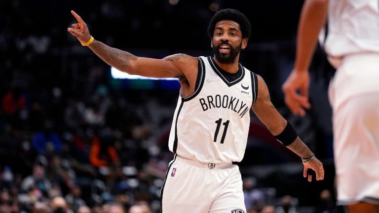 Brooklyn Nets guard Kyrie Irving shouts instructions to teammates during the first half of the team's NBA basketball game against the Washington Wizards, Thursday, Feb. 10, 2022, in Washington. (Evan Vucci/AP)