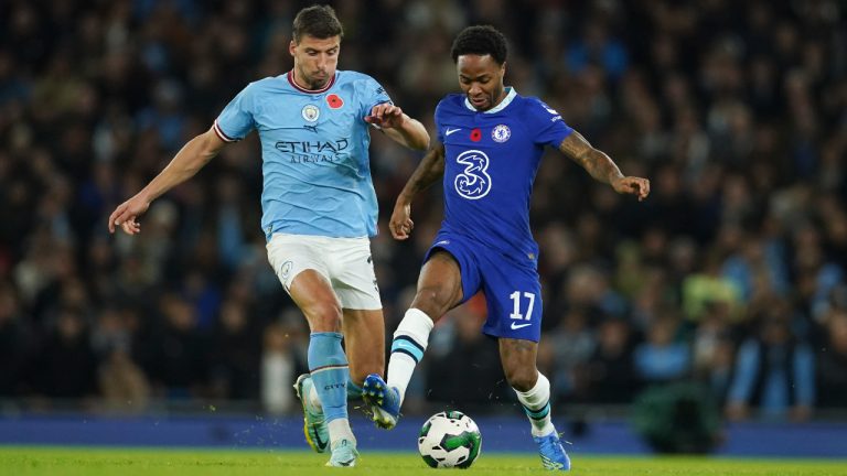 Chelsea's Raheem Sterling, right, challenges for the ball with Manchester City's Aymeric Laporte during the English League Cup third round soccer match between Manchester City and Chelsea at Etihad Stadium in Manchester, England, Wednesday, Nov. 9, 2022. (Dave Thompson/AP)