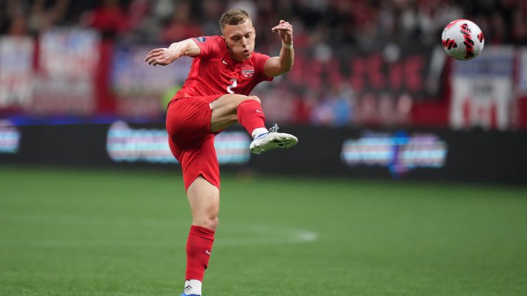 Canada's Alistair Johnston takes a shot on goal during the first half of a CONCACAF Nations League soccer match against Curacao, in Vancouver, on Thursday, June 9, 2022. THE CANADIAN PRESS/Darryl Dyck