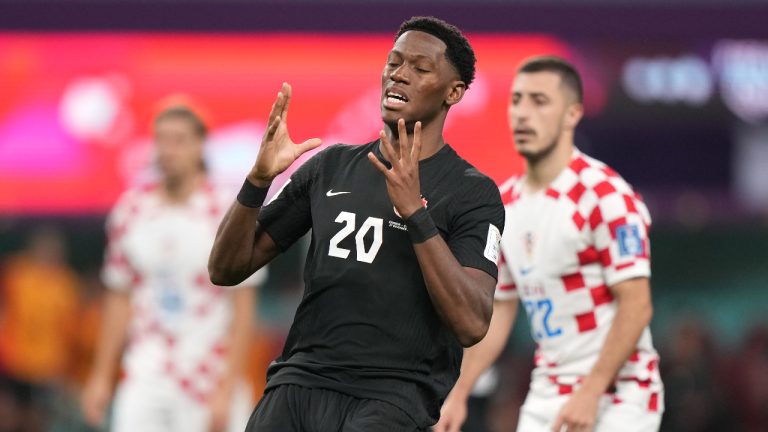 Canada forward Jonathan David (20) reacts after a missed shot on net during second half group F World Cup soccer action against Croatia at the Khalifa International Stadium in Al Rayyan, Qatar on Sunday, November 27, 2022. THE CANADIAN PRESS/Nathan Denette