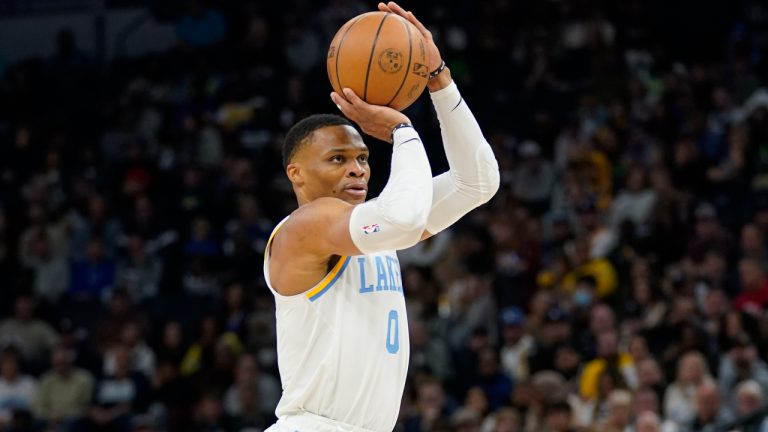 Los Angeles Lakers guard Russell Westbrook (0) shoots during the first half of an NBA basketball game against the Minnesota Timberwolves, Friday, Oct. 28, 2022, in Minneapolis. (AP Photo/Abbie Parr)