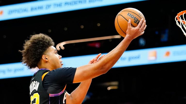 Phoenix Suns' Cameron Johnson goes to the basket untouched by any Houston Rockets during the second half of an NBA basketball game, Sunday, Oct. 30, 2022, in Phoenix. (Darryl Webb/AP)