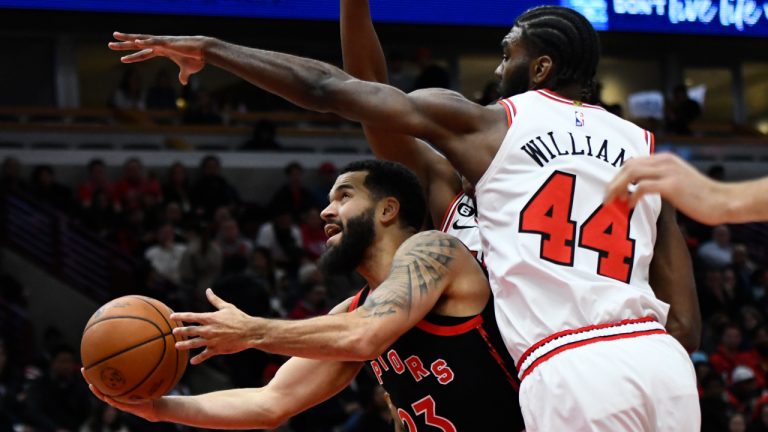 Toronto Raptors' Fred VanVleet (23) goes up for a shot as Chicago Bulls' Patrick Williams (44) defends during the first half of an NBA basketball game Monday, Nov. 7, 2022, in Chicago. (AP Photo/Paul Beaty)