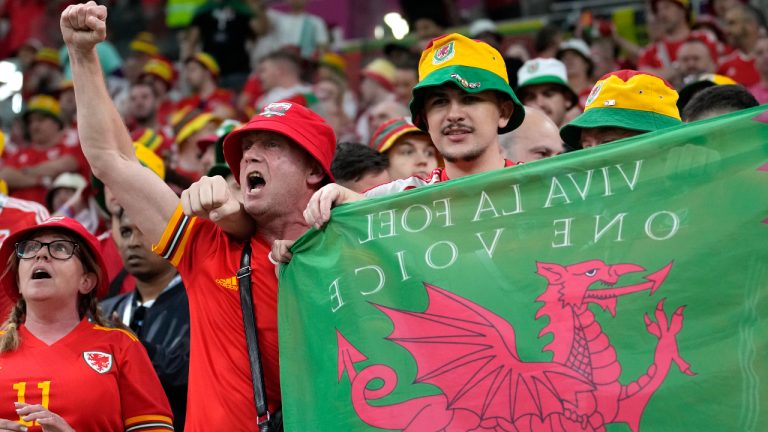 Wales fans cheer ahead the World Cup, group B soccer match between the United States and Wales, at the Ahmad Bin Ali Stadium in in Doha, Qatar, Monday, Nov. 21, 2022. (AP Photo/Ashley Landis)