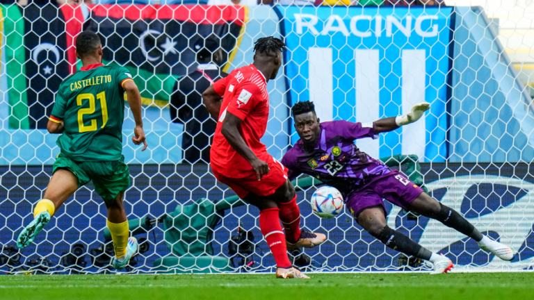 Switzerland's Breel Embolo scores the opening goal during the World Cup group G soccer match between Switzerland and Cameroon, at the Al Janoub Stadium in Al Wakrah, Qatar, Thursday, Nov. 24, 2022. (AP)