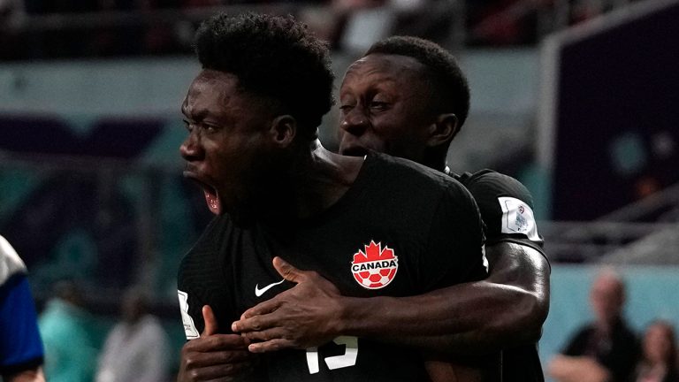 Canada's Alphonso Davies celebrates after scoring his side's opening goal during the World Cup group F soccer match between Croatia and Canada, at the Khalifa International Stadium in Doha, Qatar, Sunday, Nov. 27, 2022. (Thanassis Stavrakis/AP)