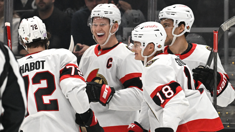 Ottawa Senators left wing Brady Tkachuk, second from left, smiles after scoring a goal against the Los Angeles Kings during the first period of an NHL hockey game Sunday, Nov. 27, 2022, in Los Angeles. (AP)