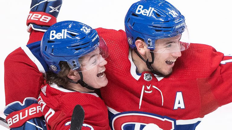 Cole Caufield and Nick Suzuki. (Graham Hughes/CP)