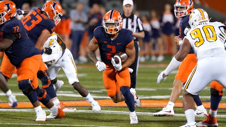 Illinois running back Chase Brown breaks into the open during the first half of the team's NCAA college football game against Chattanooga on Thursday, Sept. 22, 2022, in Champaign, Ill. (Charles Rex Arbogast/AP)