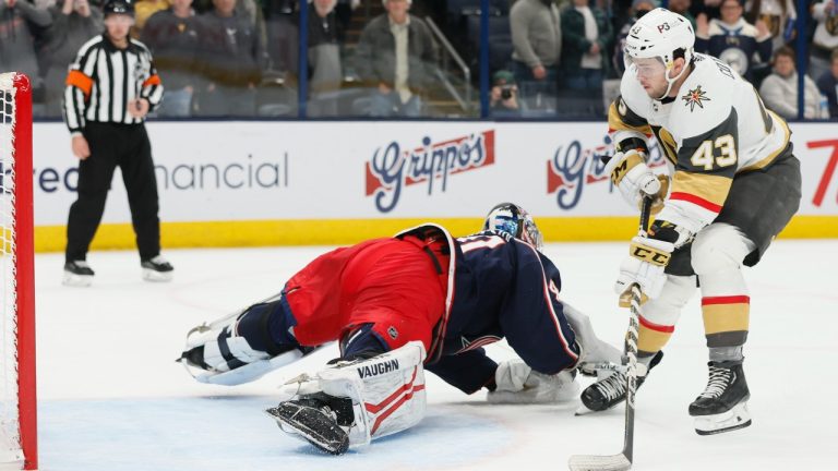 Vegas Golden Knights' Paul Cotter, right, scores against Columbus Blue Jackets' Daniil Tarasov during the shoot out period of an NHL hockey game on, Monday, Nov. 28, 2022, in Columbus, Ohio. (Jay LaPrete/AP Photo)