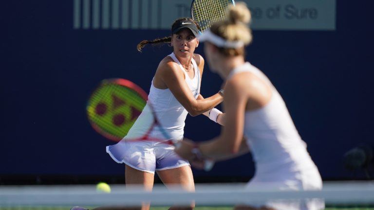 Giuliana Olmos, left, of Mexico, returns to Coco Gauff and Jessica Pegula as her partner Gabriela Dabrowski, of Canada, looks on during the doubles final at the San Diego Open tennis tournament Sunday, Oct. 16, 2022, in San Diego. (Gregory Bull/AP)