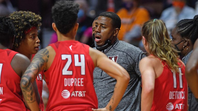 Atlanta Dream head coach Darius Taylor huddles his team during a timeout in a WNBA basketball game against the Connecticut Sun, Sunday, Sept. 19, 2021, in Uncasville, Conn. (Sean D. Elliot/The Day via AP)