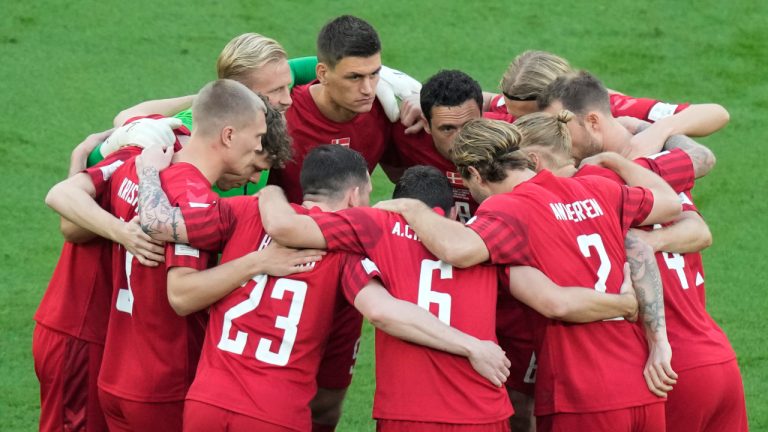 Denmark's team players hug prior the World Cup group D soccer match between Denmark and Tunisia at the Education City Stadium in Al Rayyan, Qatar. (Darko Bandic/AP)