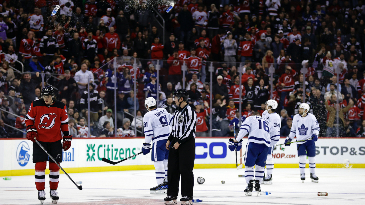 Devils fans launch beer cans on ice after NHL referees call back third New  Jersey goal