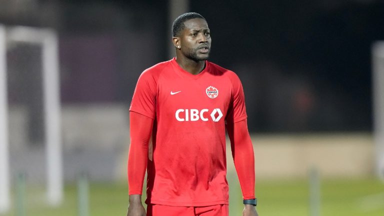 Canada's Doneil Henry an injured defender who's with the team in a non-playing role walks during practice at the World Cup in Doha, Qatar on Tuesday, November 29, 2022. Nathan Denette/THE CANADIAN PRESS