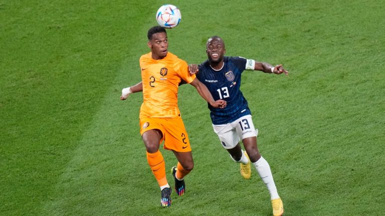 Jurrien Timber of the Netherlands, left, and Ecuador's Enner Valencia go for a header during the World Cup group A soccer match between the Netherlands and Ecuador, at the Khalifa International Stadium in Doha, Qatar, Friday, Nov. 25, 2022. (AP)