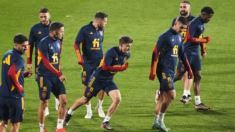 Gavi (centre) runs during a training session with teammates ahead of the 2022 World Cup in Qatar.  (Paul White/AP)