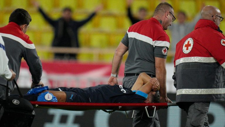 Medical staff carry Marseille's Amine Harit off during a Ligue 1 match between Monaco and Marseille at the Stade Louis II in Monaco, Sunday, Nov. 13, 2022. Harit was selected to the Moroccan national team only days before (Daniel Cole/AP Photo)