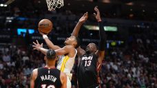 Butler takes over late to lead Heat past Warriors